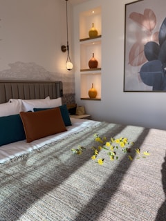 a bed with a bunch of flowers on top of it