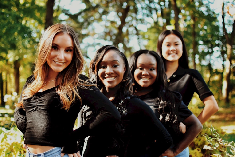 a group of women standing next to each other