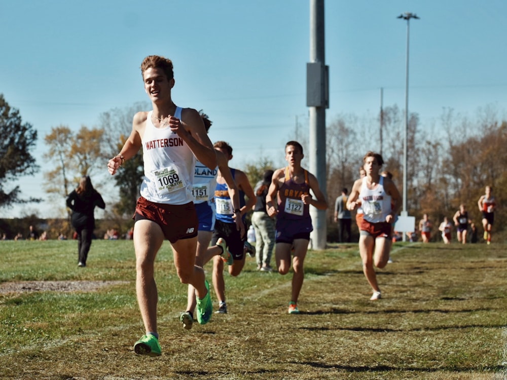 a group of men running across a field