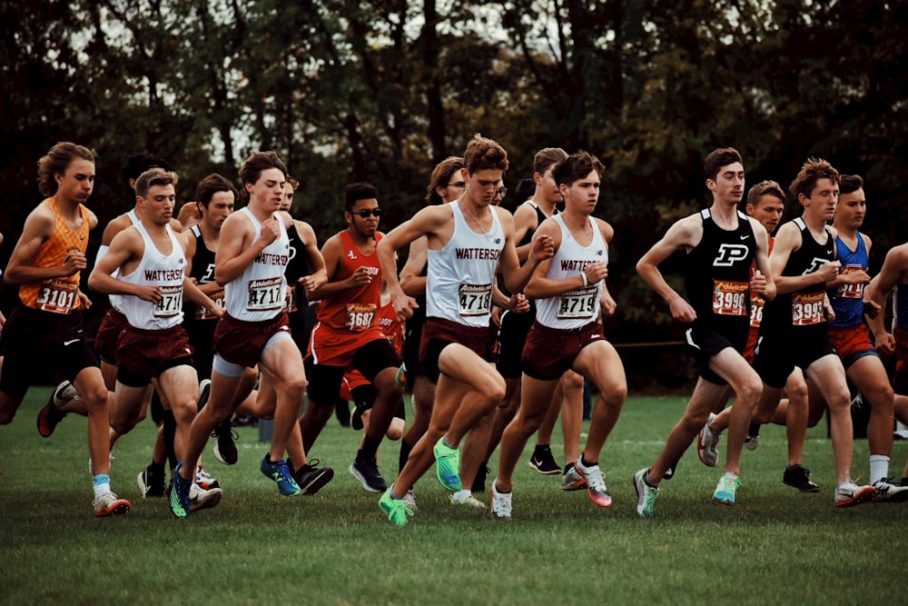 a group of men running in a race