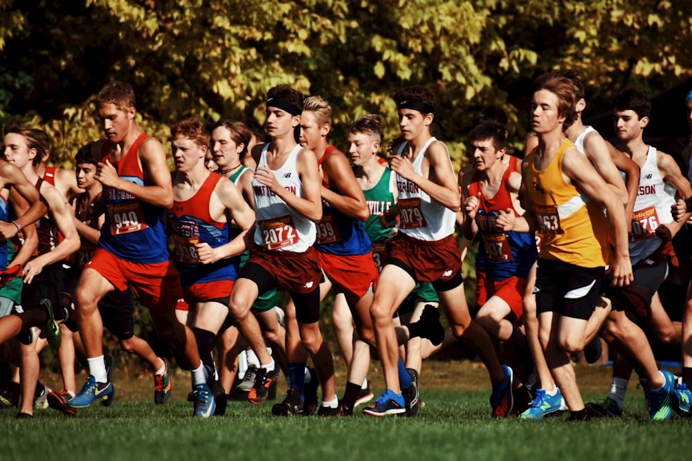 a group of men running in a race
