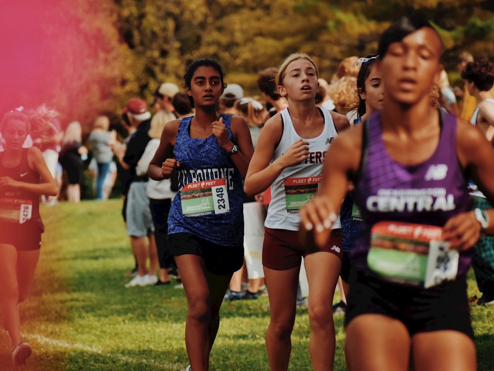 a group of people running in a race