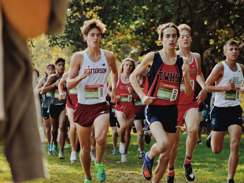 a group of young men running in a race