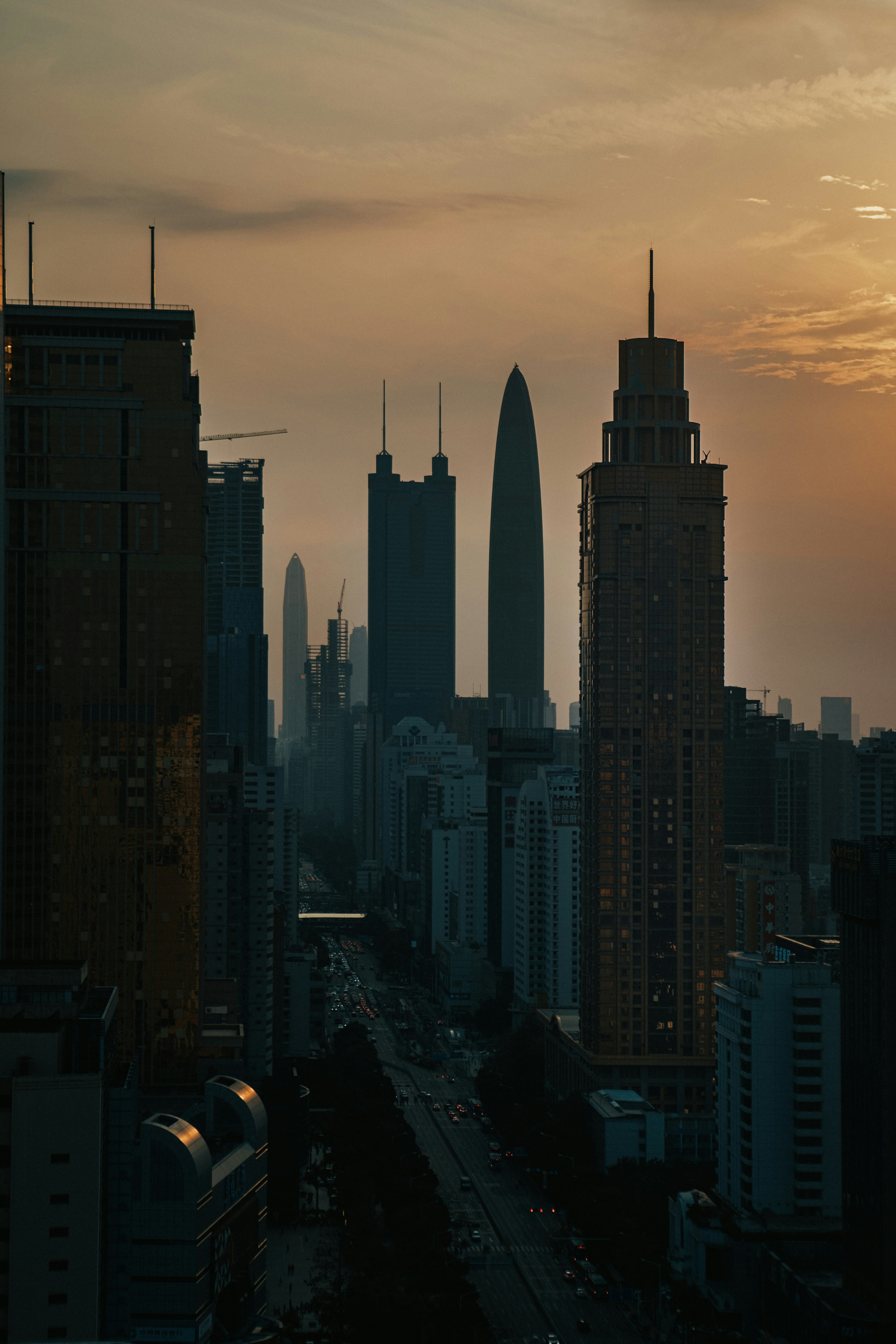 a view of a city skyline at sunset
