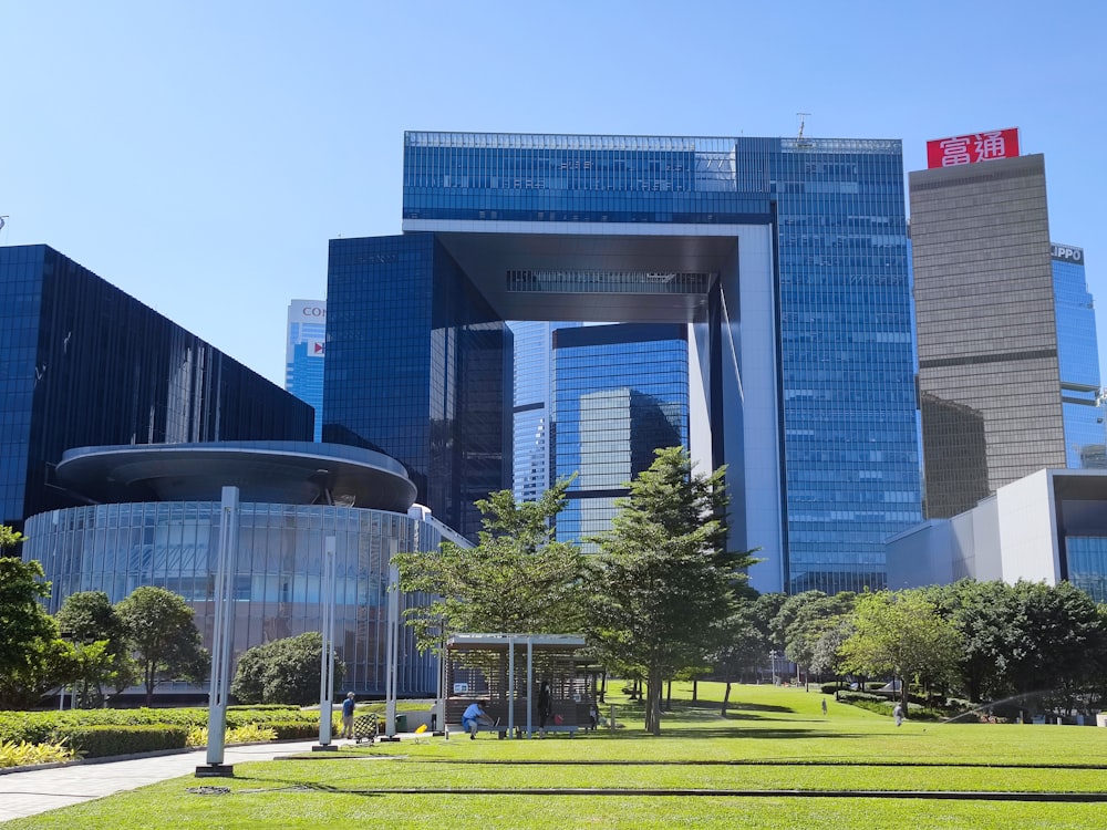 a grassy area in front of a large building