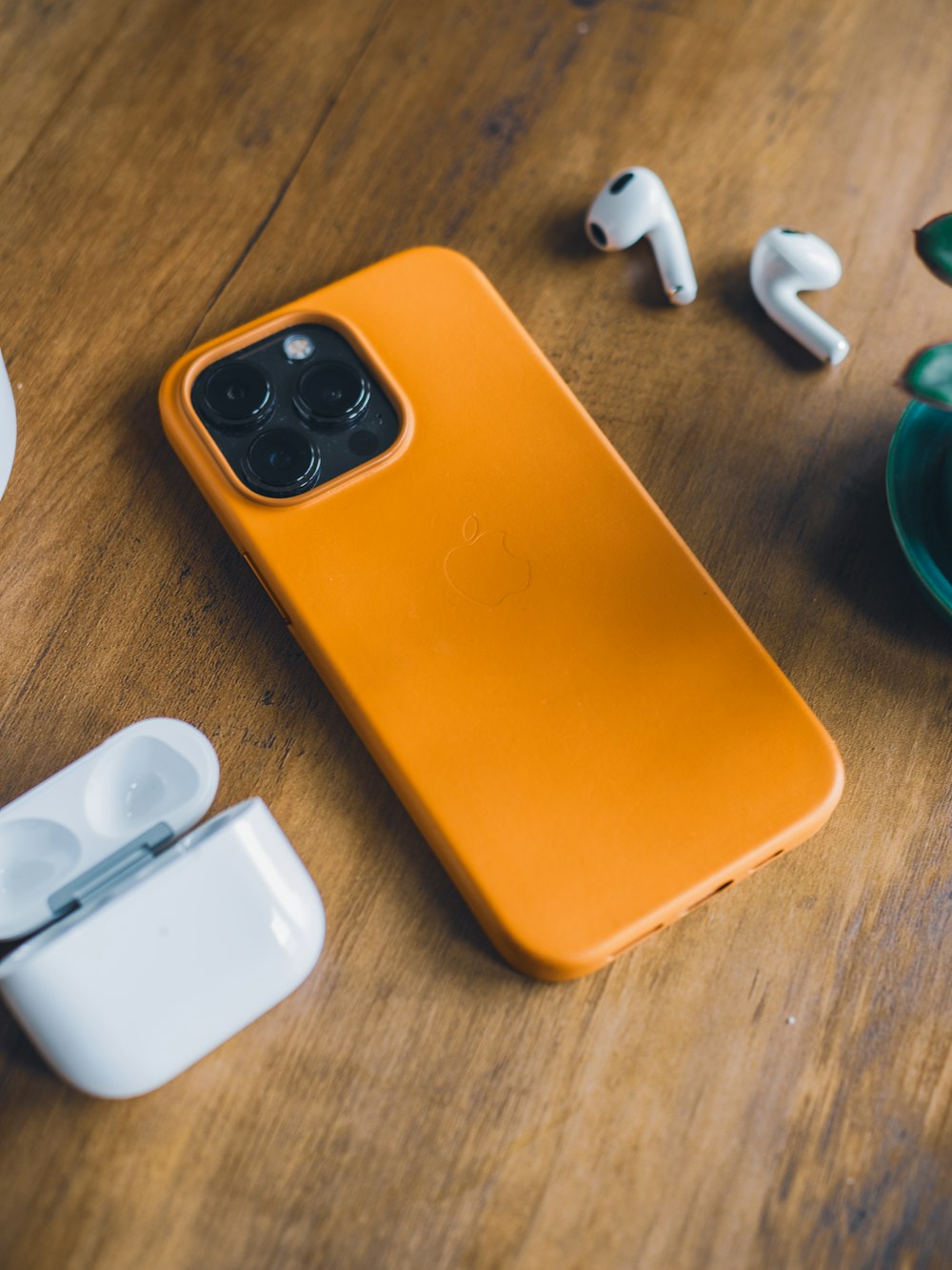 an orange case sitting on top of a wooden table