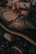 Spartan-style boots on a rugged terrain background