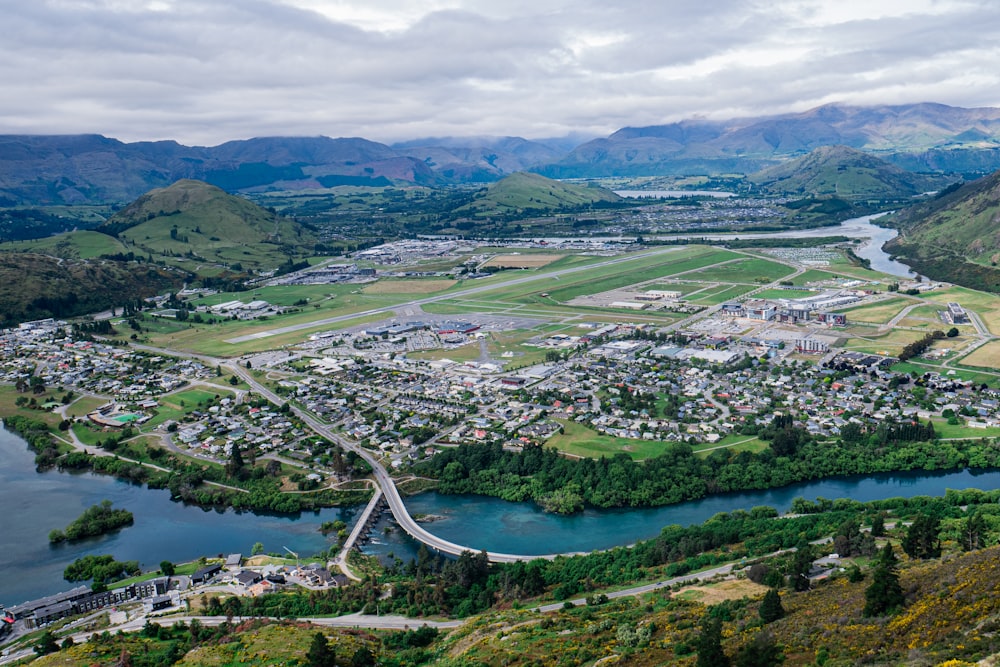 an aerial view of a town and a river