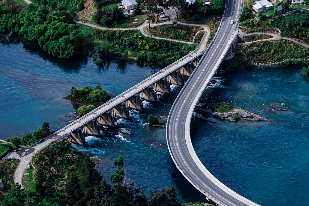 an aerial view of a bridge over a body of water