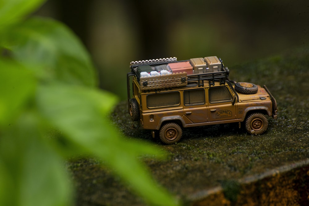 a toy jeep with luggage on top of it