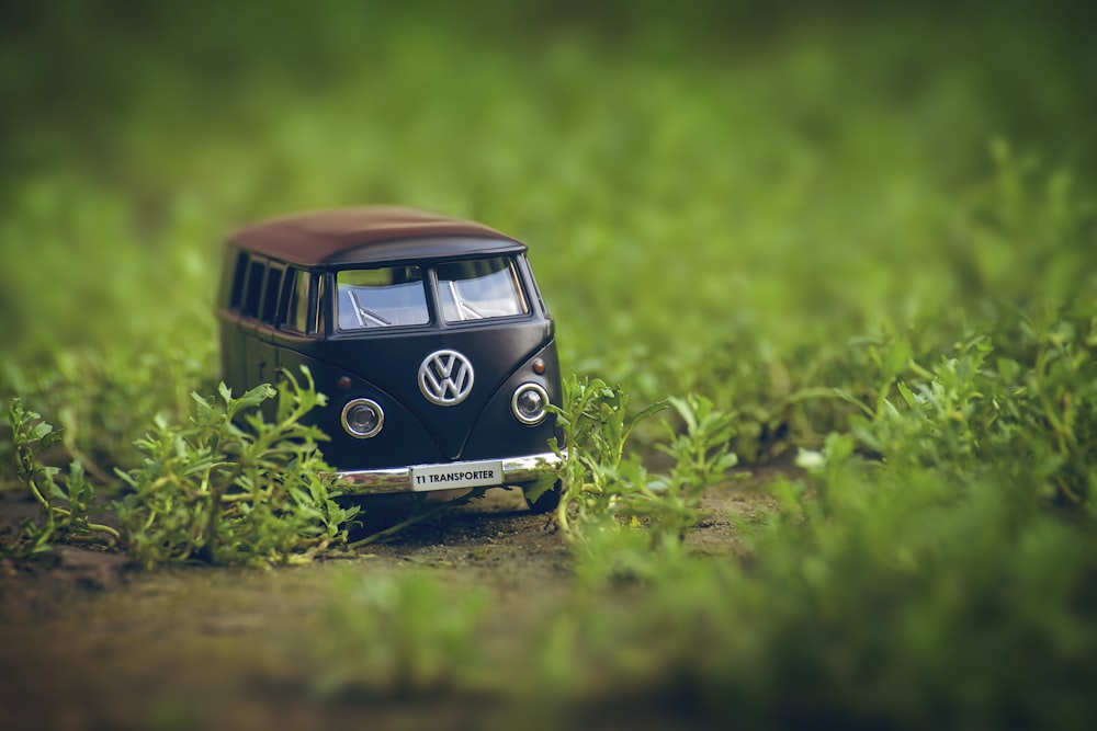a miniature vw bus is sitting in the grass