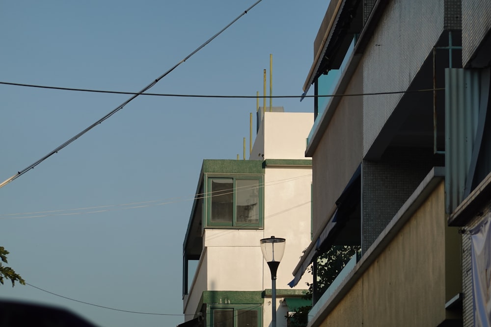 a tall building with a street light next to it