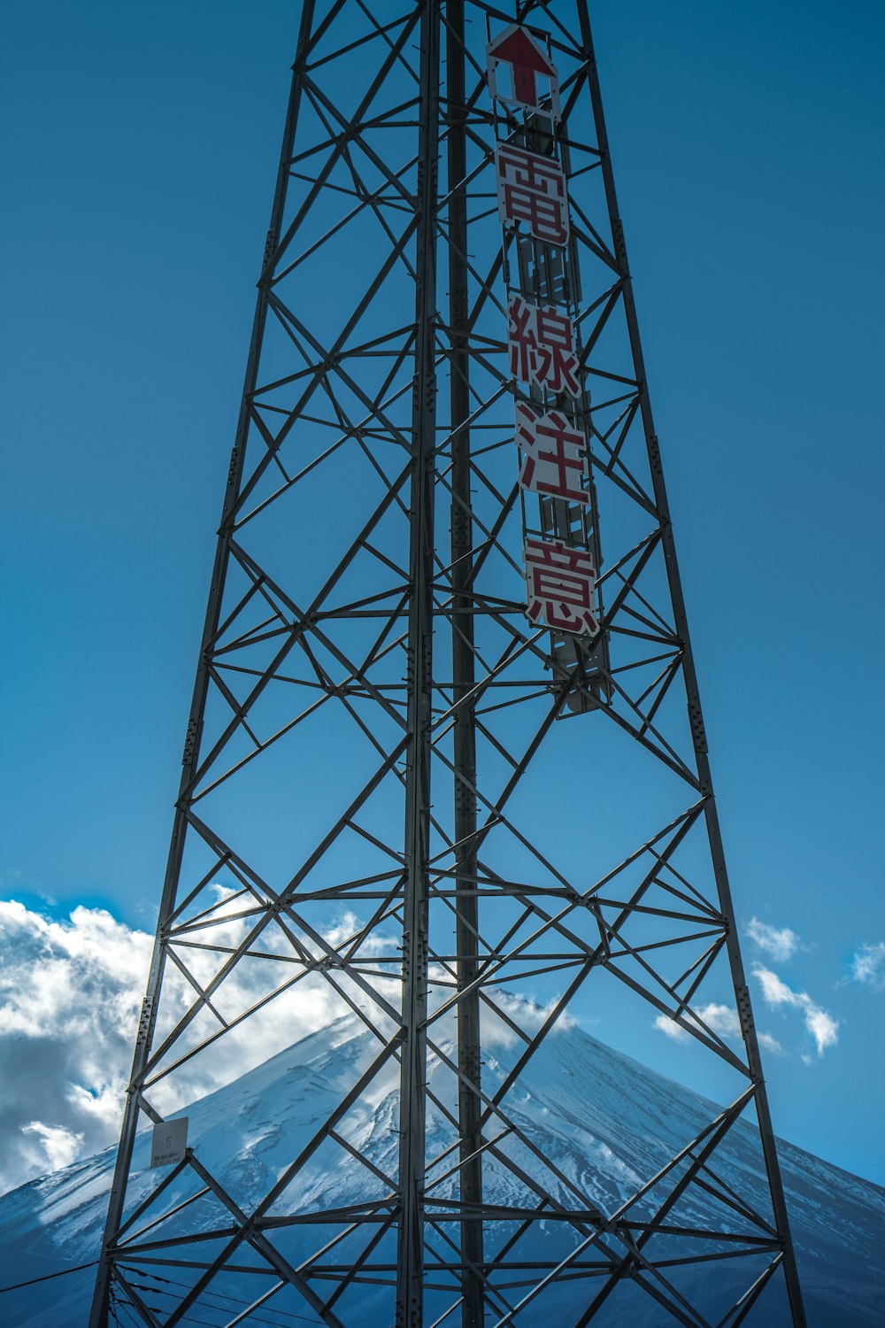 a tall tower with a flag on top of it