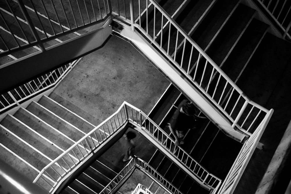 a black and white photo of a spiral staircase