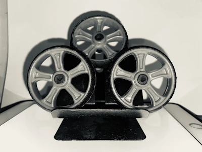 Set of three different car wheels displayed on a clean white background.