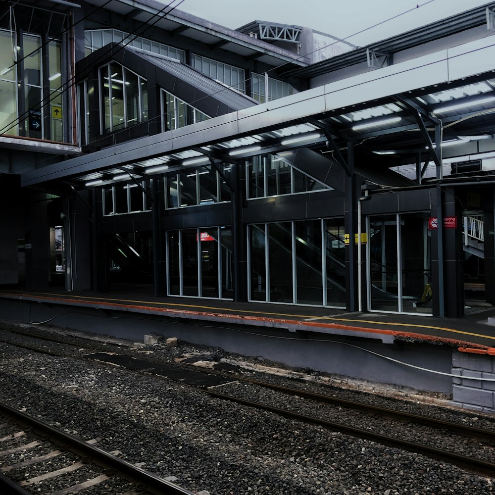 a train station with a train on the tracks