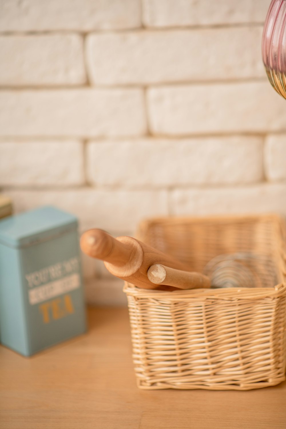 a wicker basket with a wooden spoon in it