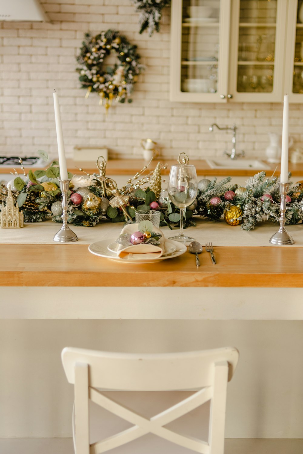 a dining room table set for christmas dinner