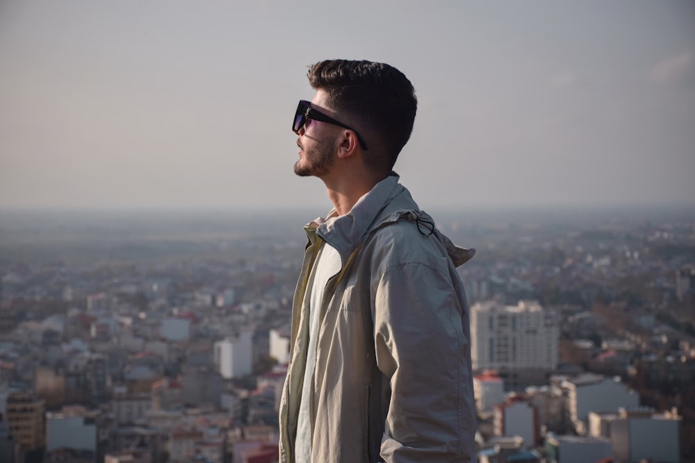 a man standing on top of a tall building