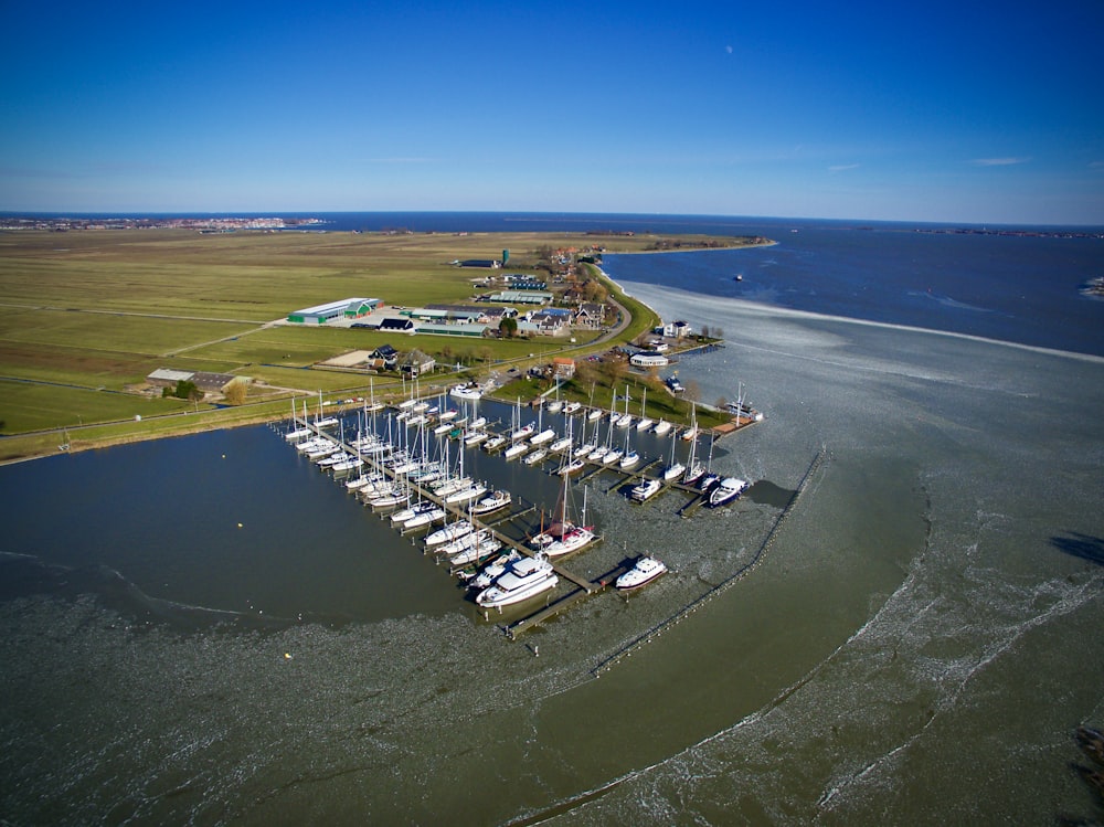 an aerial view of a marina with many boats