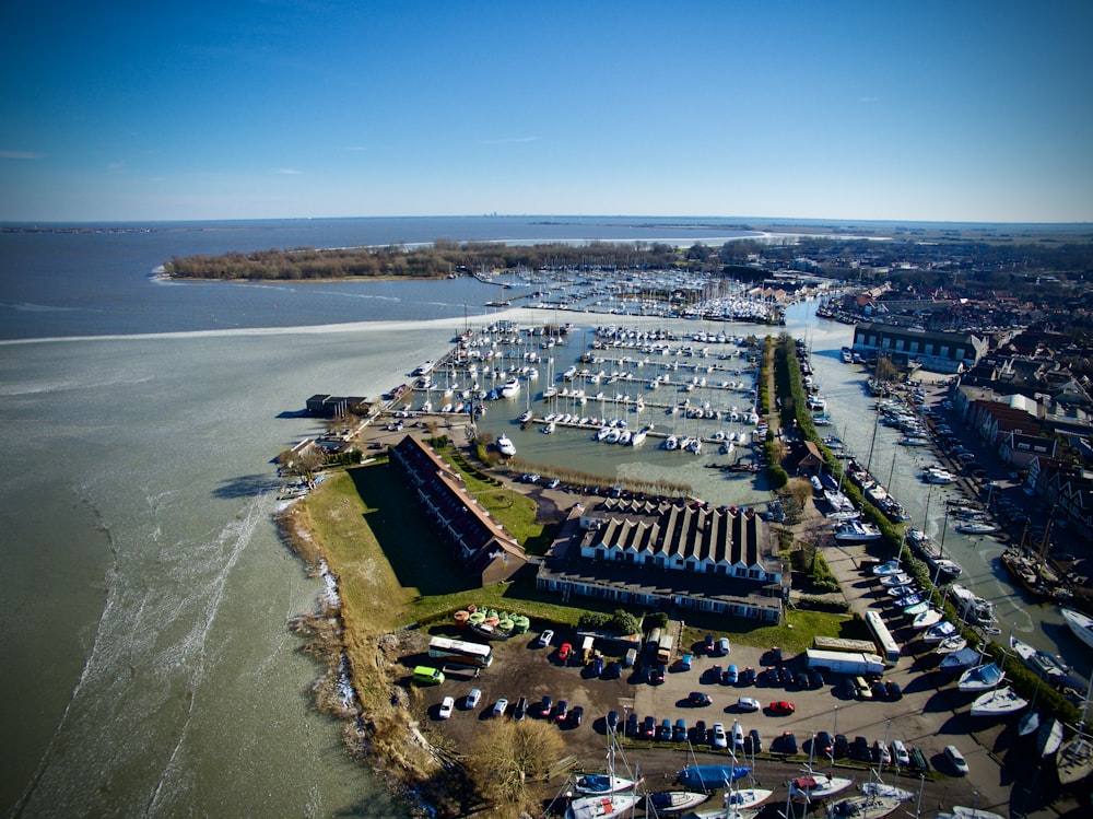 an aerial view of a marina with many boats