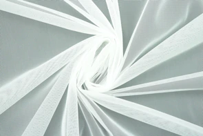 Close-up of a delicate, simple swimsuit fabric texture in soft pastel tones