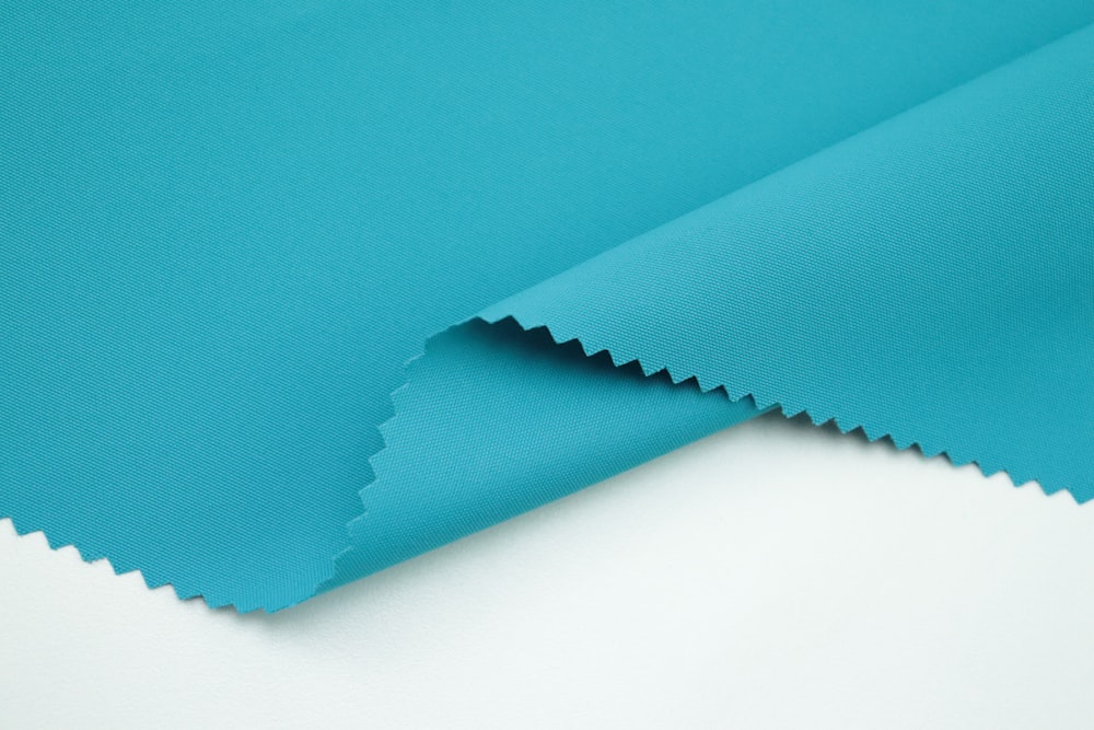 a close up of a turquoise colored fabric
