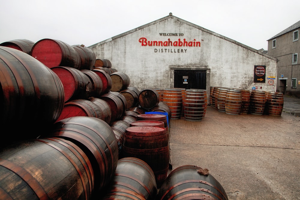 a bunch of barrels that are outside of a building