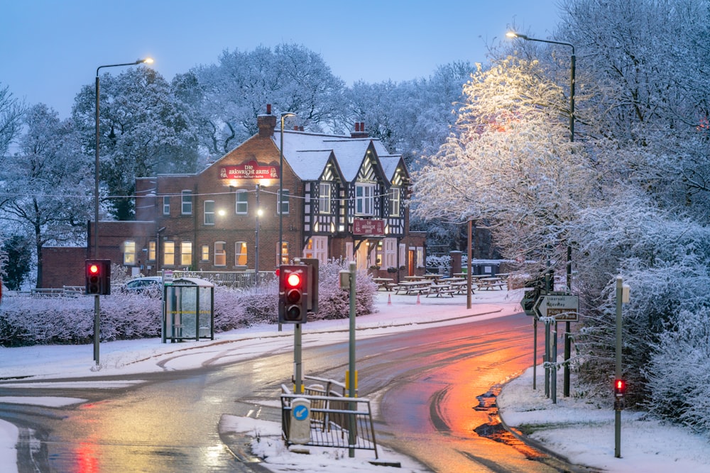 a red traffic light on a snowy street