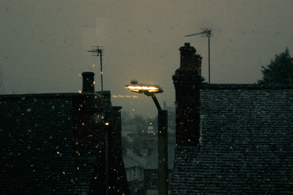 a view of a street light in the snow