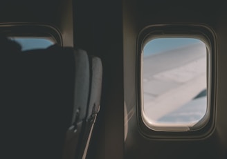 a view of the wing of an airplane through a window