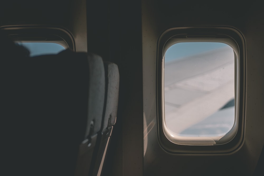 a view of the wing of an airplane through a window