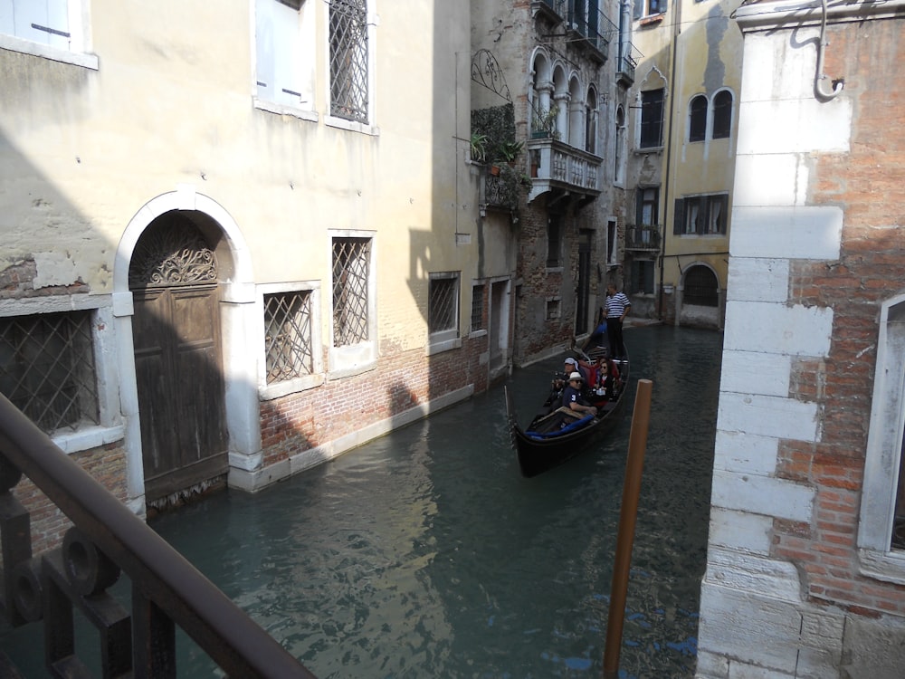 a gondola is moving down a narrow canal in venice