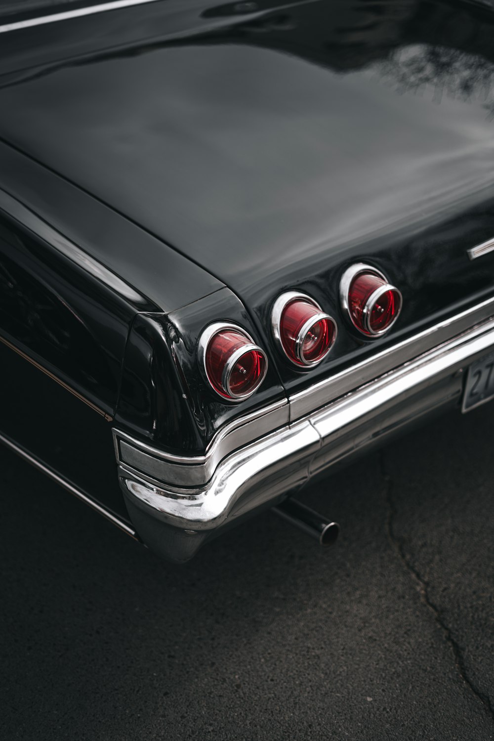 a close up of the tail lights of a classic car