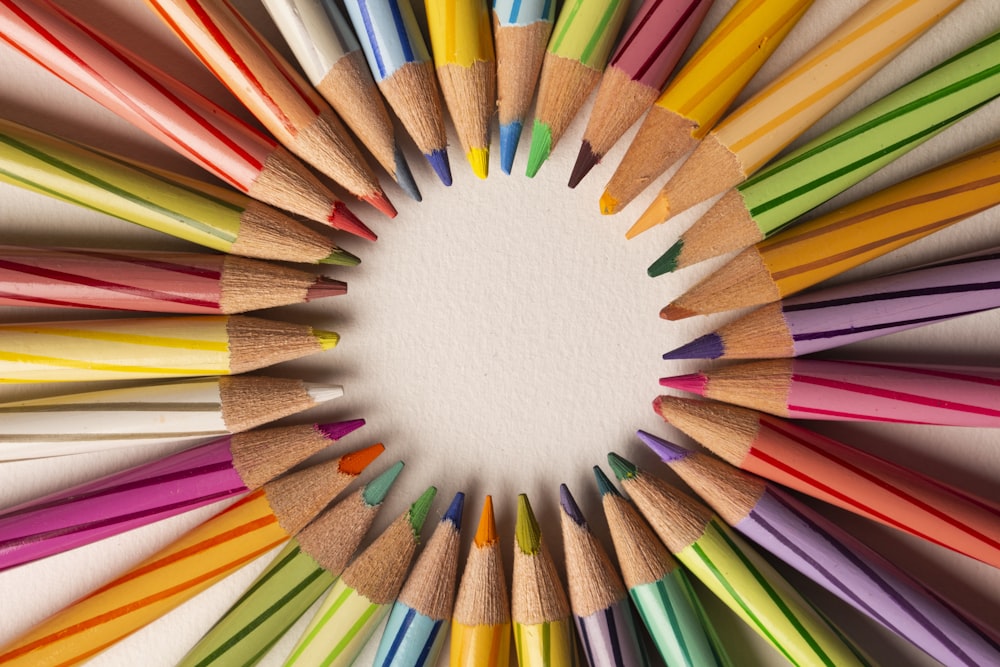 a circle of colored pencils arranged in a circle