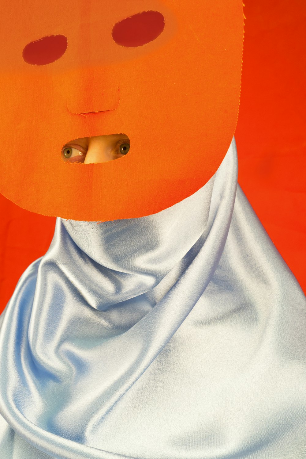 a painting of a person wearing an orange mask