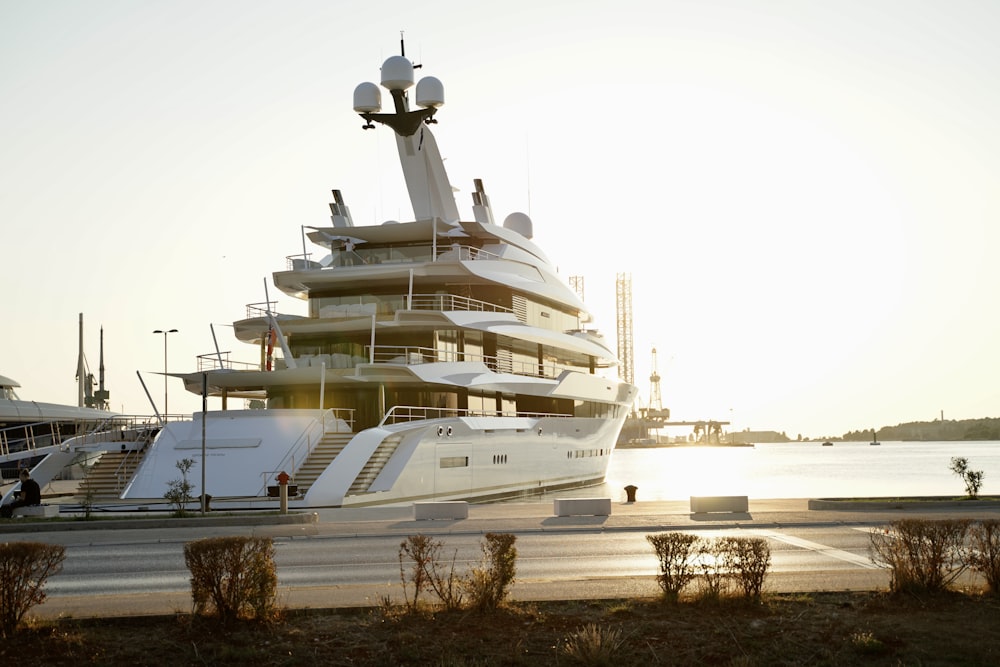 a large white boat sitting on top of a body of water