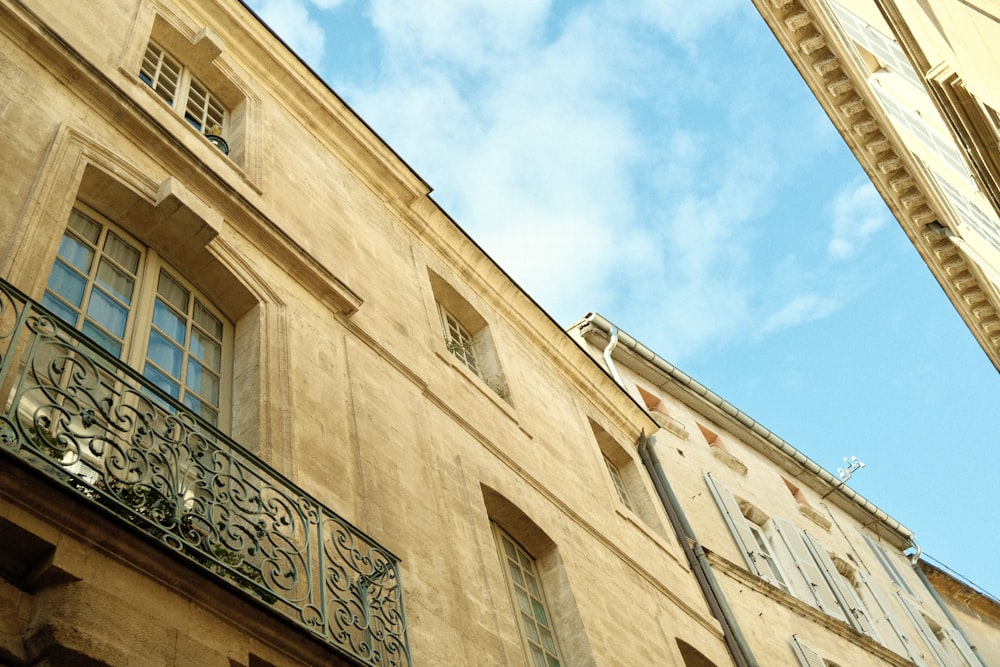 a building with a balcony and a clock on it