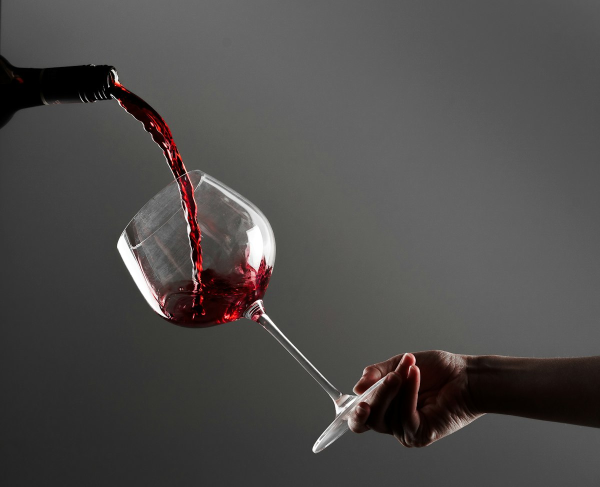 Estate red wine being poured into a glass