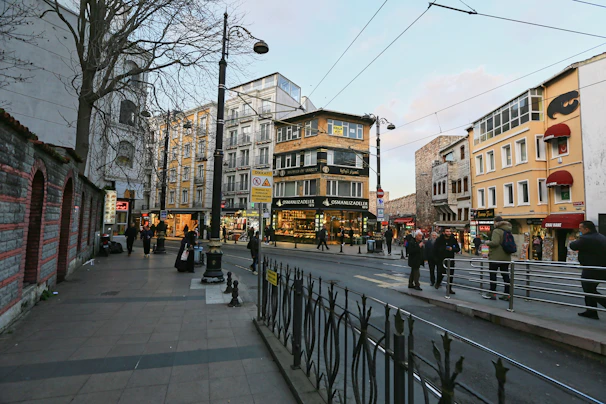 Urban commercial street view showing multiple storefronts and pedestrian walkways