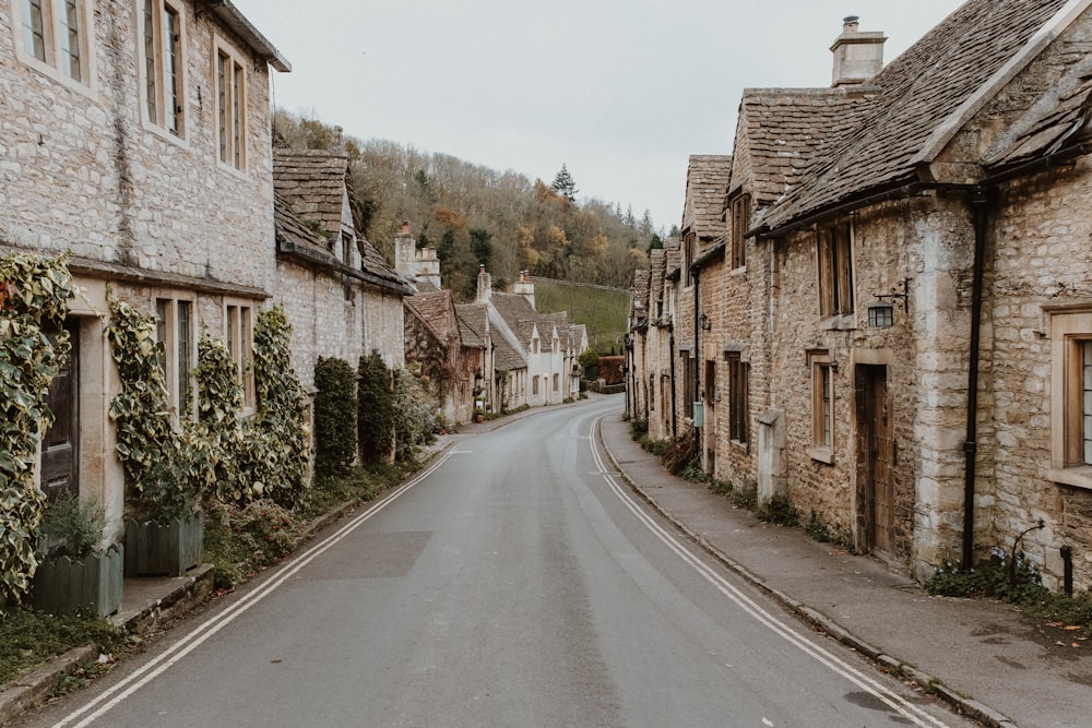 an empty street lined with stone buildings