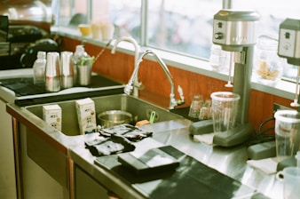 A clean and functional kitchen sink after service.