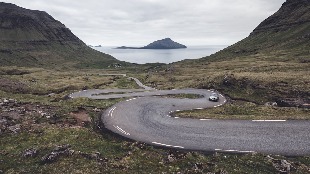 a car driving down a winding mountain road