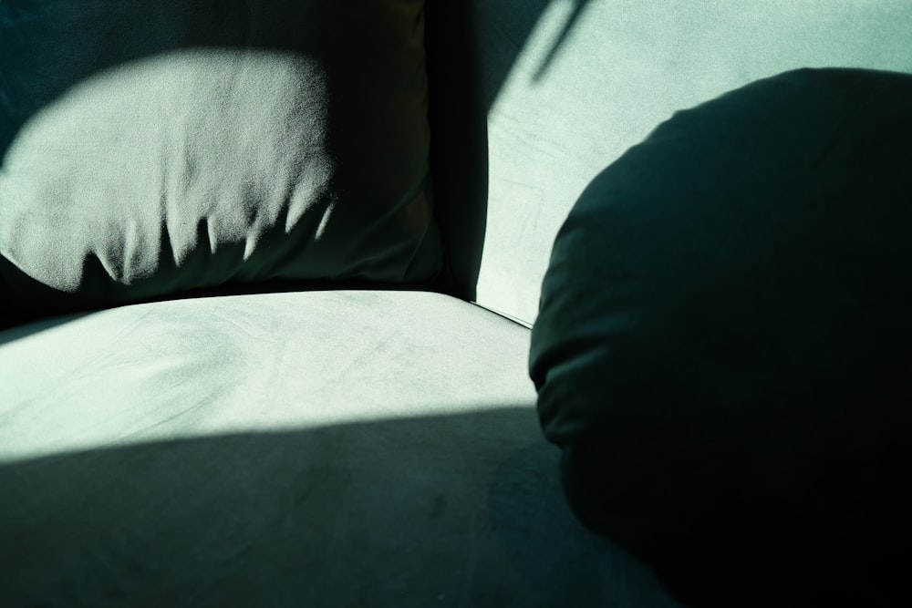 a close up of a pillow on a couch
