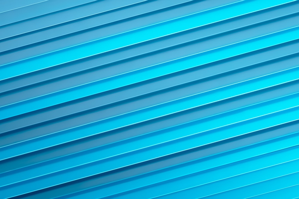 a close up of a blue wall with vertical lines