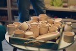 a tray of pottery sitting on top of a table
