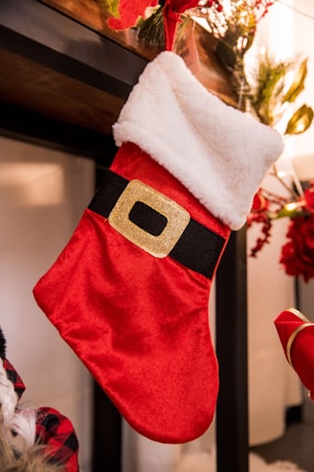 a christmas stocking hanging from a fireplace