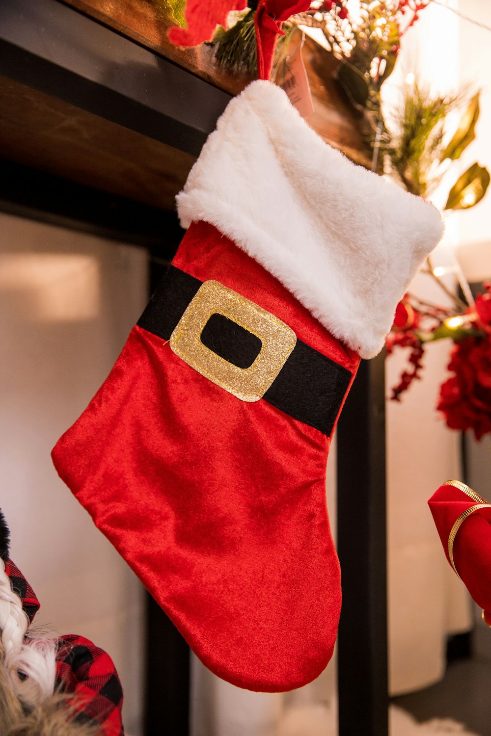 a christmas stocking hanging from a fireplace