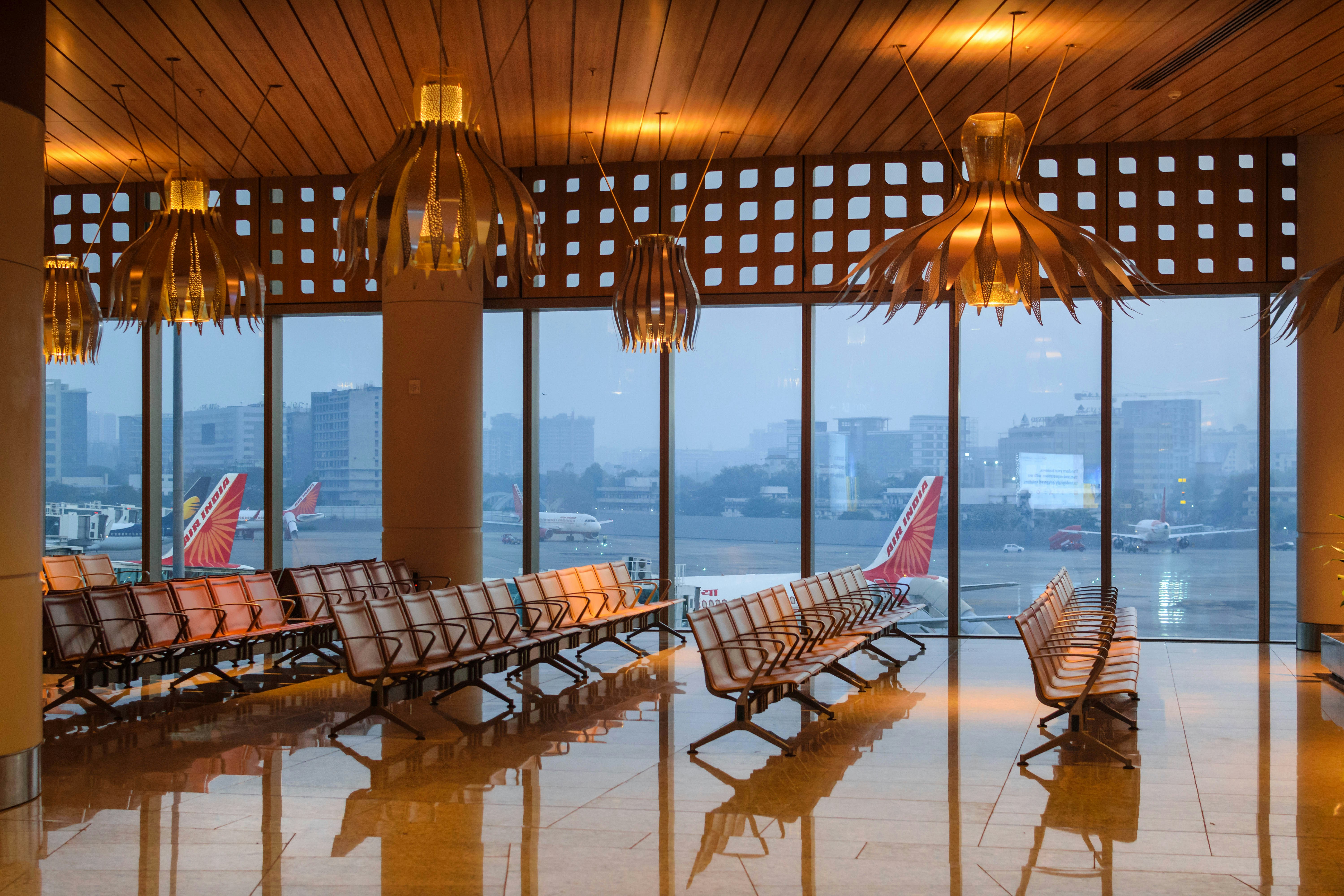 a row of chairs sitting in front of a window, Waiting Area, Mumbai Airport (Chhatrapati Shivaji Maharaj International Airport), Mumbai, Maharashtra, India