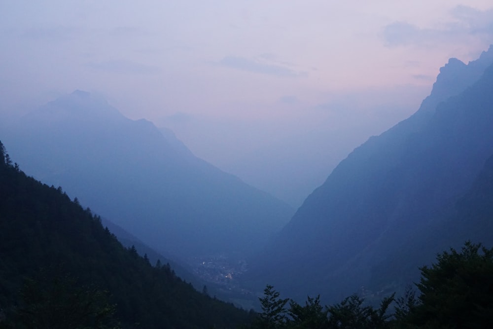 a view of a valley with mountains in the background